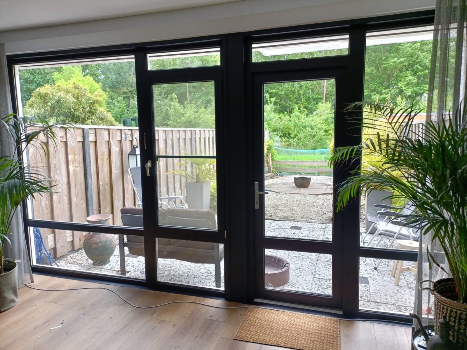 Patio doors and window frames in black on the inside, wrapped