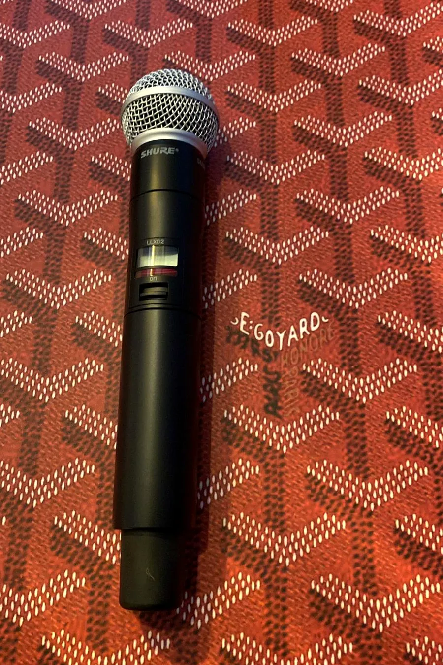 Before: black wireless Shure ULXD2 microphone, not yet wrapped