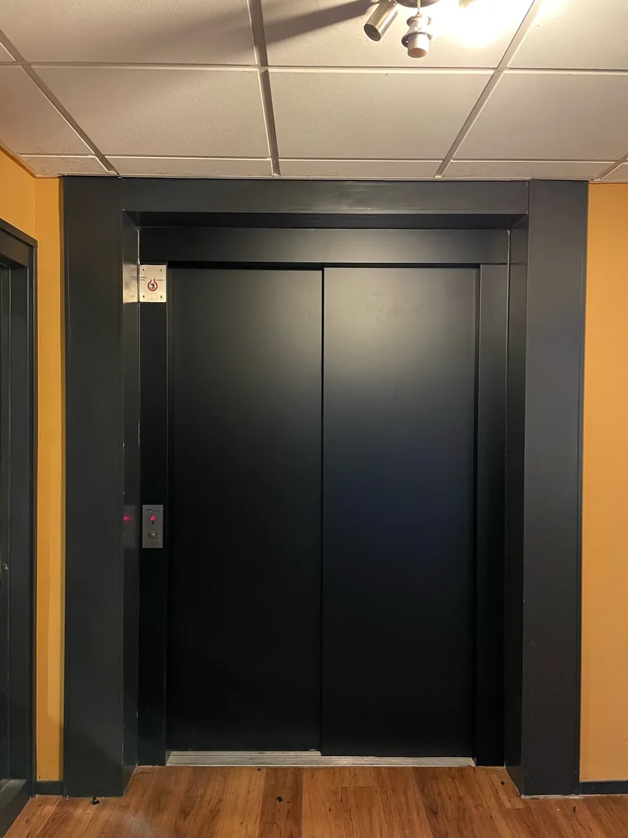 Lift doors wrapped in matt black
