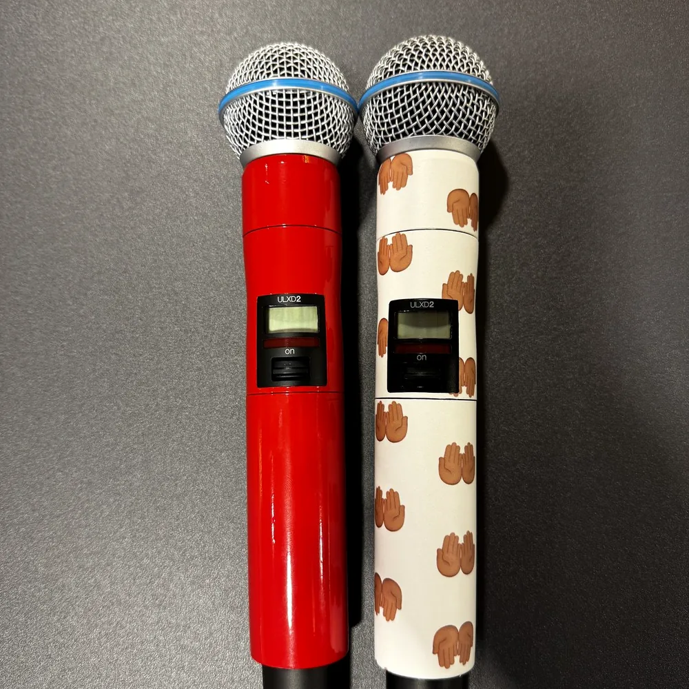 Two wireless microphones side by side: one in gloss red and one in a white custom print
