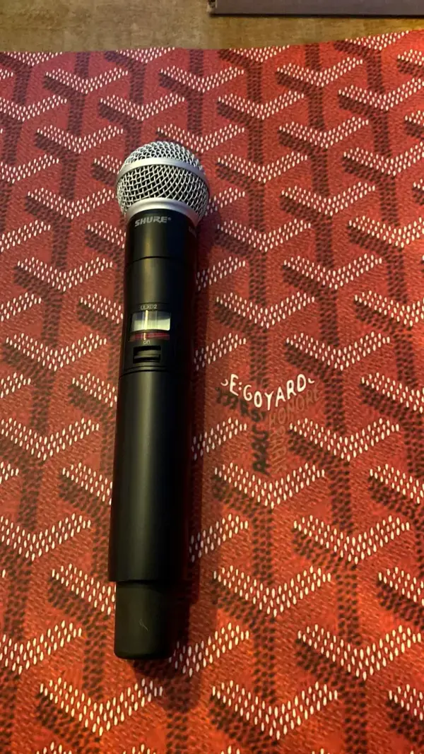 Before: black wireless microphone, not yet wrapped