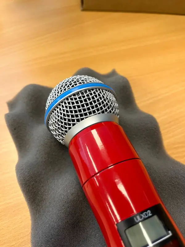 Microphone in gloss red, from above at an angle