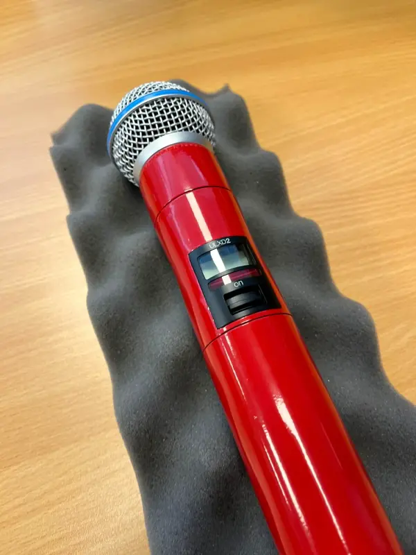 Microphone in gloss red, close up