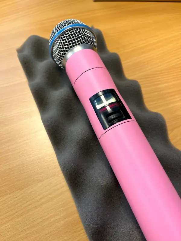 Microphone in matt pink, from above at an angle