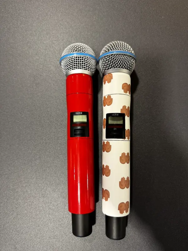 Two microphones: one in gloss red and one in a white custom print
