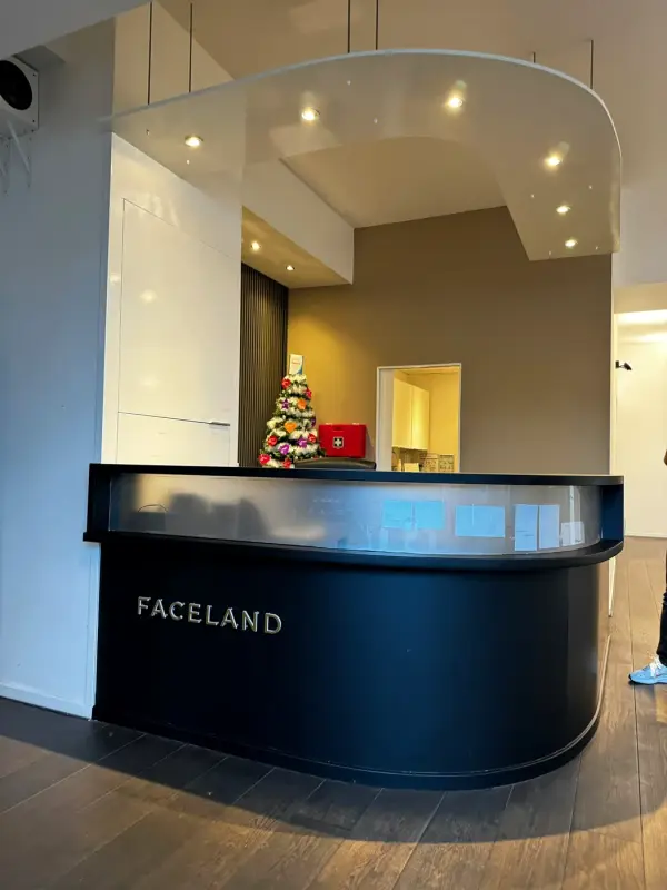 Reception desk in matt black in the entrance, with Christmas lights