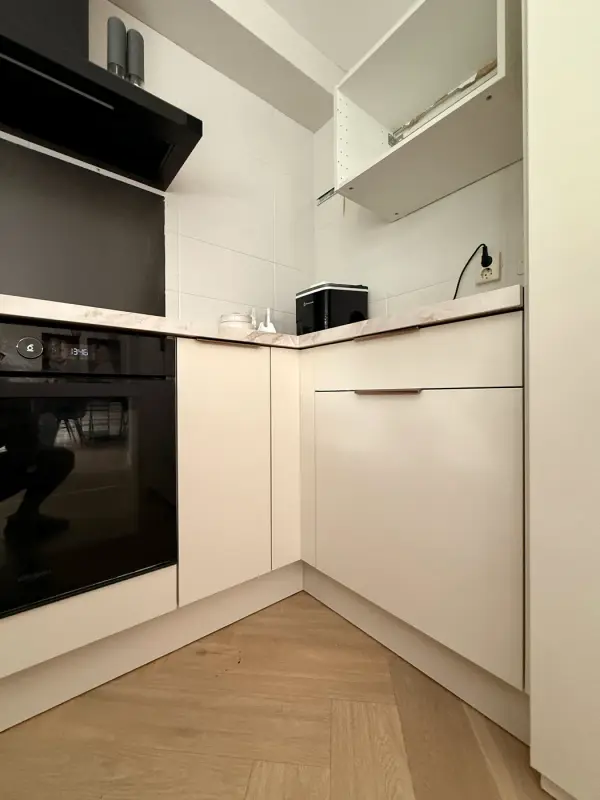 Kitchen with oven and tall cabinet
