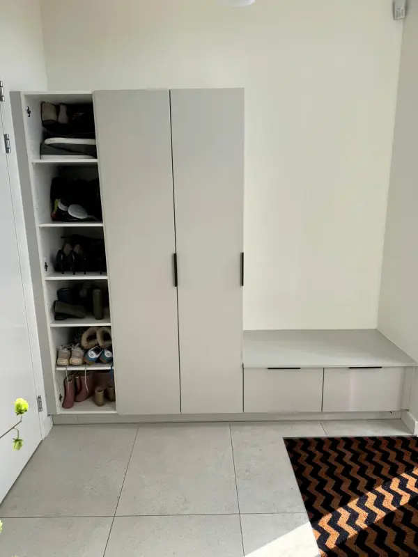 Before: white wardrobe with a shoe rack