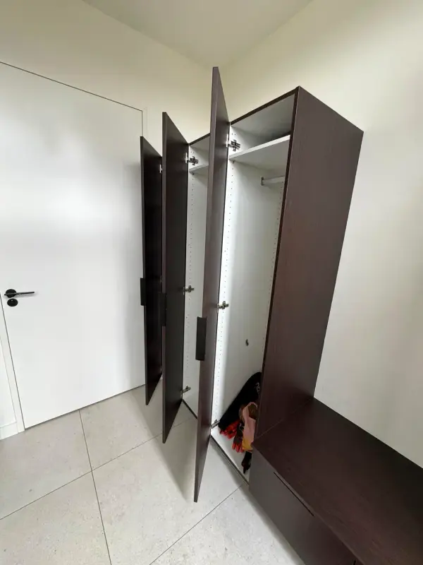 After: wardrobe in dark wood with the door open