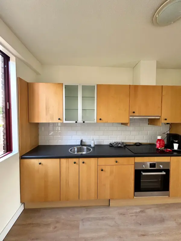 Before: wood kitchen straight on