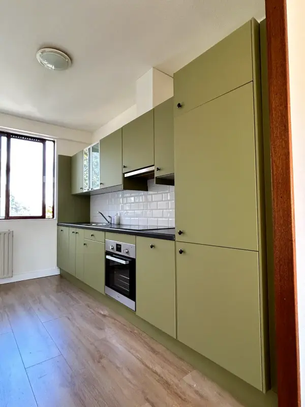 After: kitchen in matt green, from the side