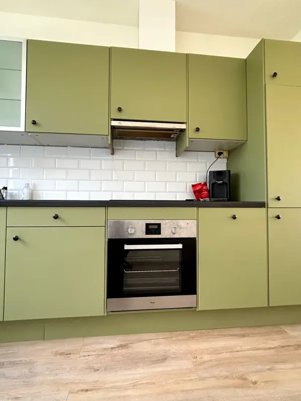 After: green kitchen wall with oven