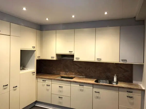 Before: cream kitchen from the side