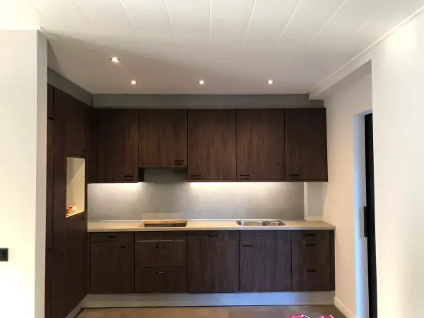 After: kitchen wall in dark woodgrain
