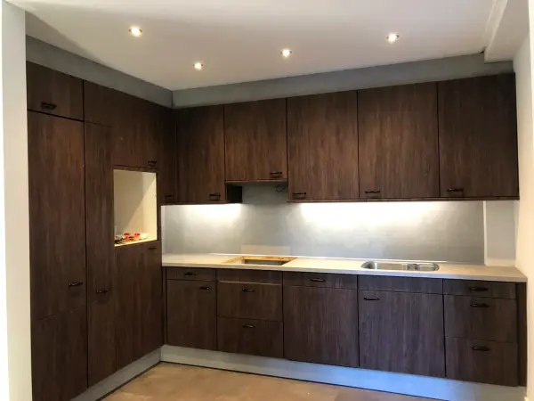After: kitchen in dark woodgrain, from the side
