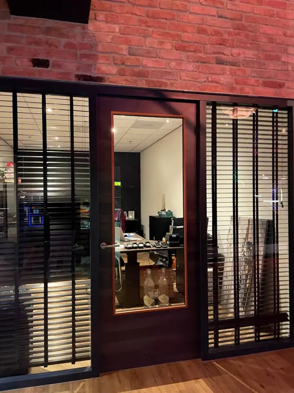 Before: office door with clear glass and a view inside
