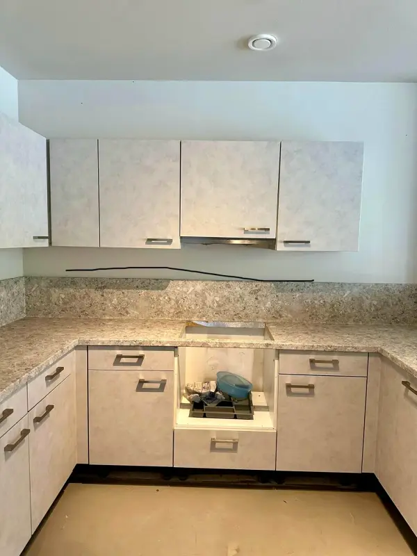 After: the same U-shaped kitchen after wrapping