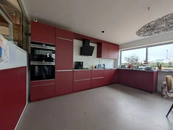 Red kitchen seen along its length