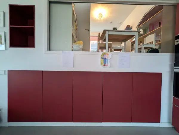 Red cabinet wall under the window