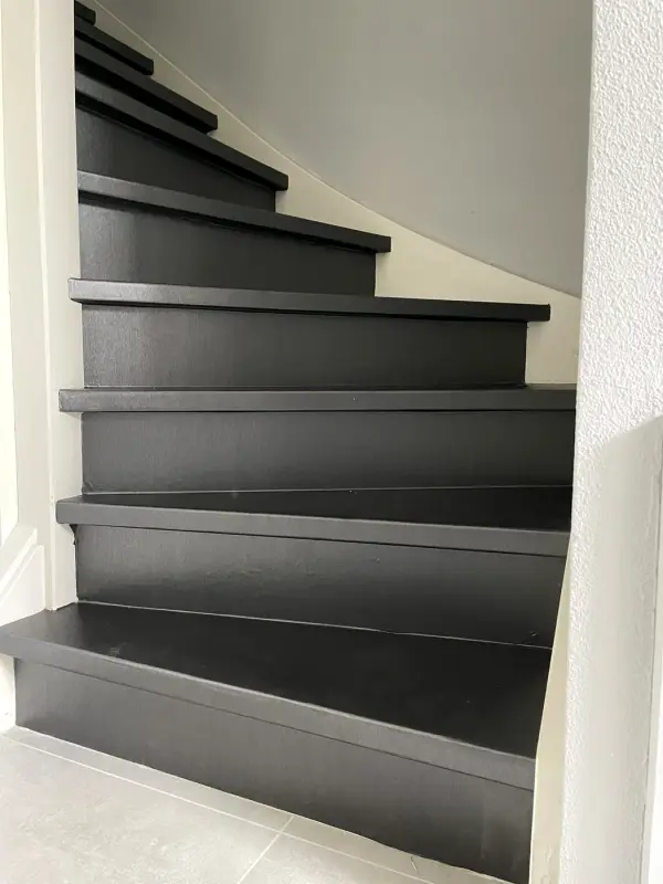 Bottom steps of the stairs in black