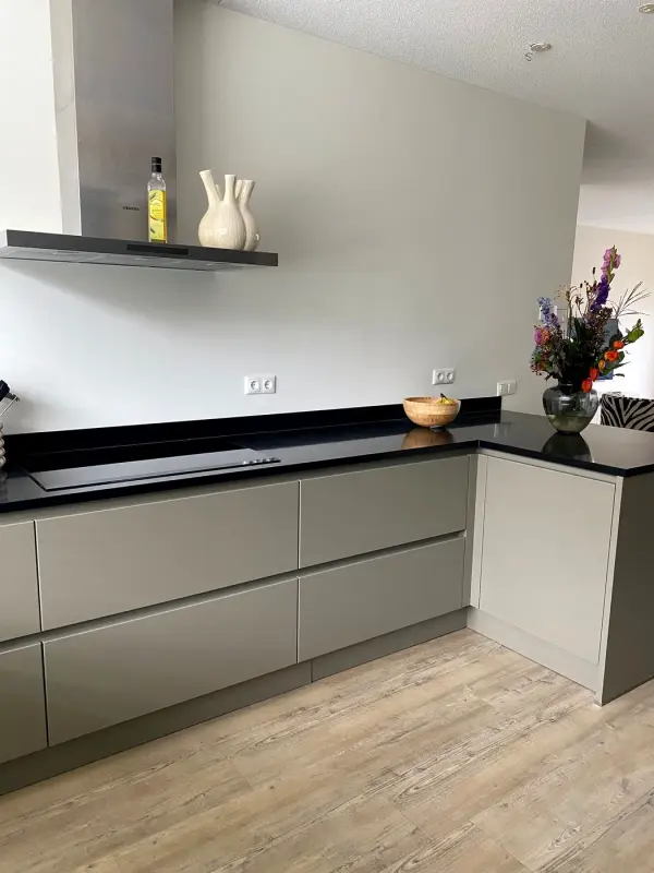After: kitchen with an open shelf and peninsula