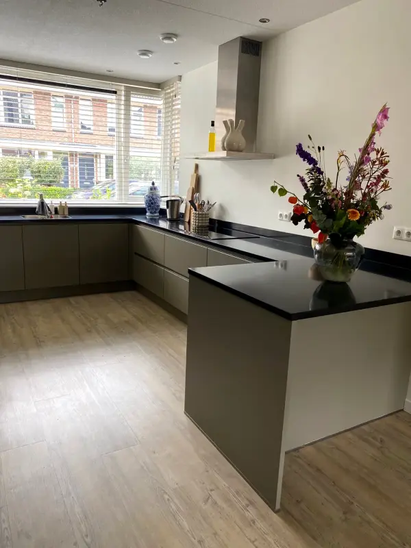After: kitchen in warm grey-green matt