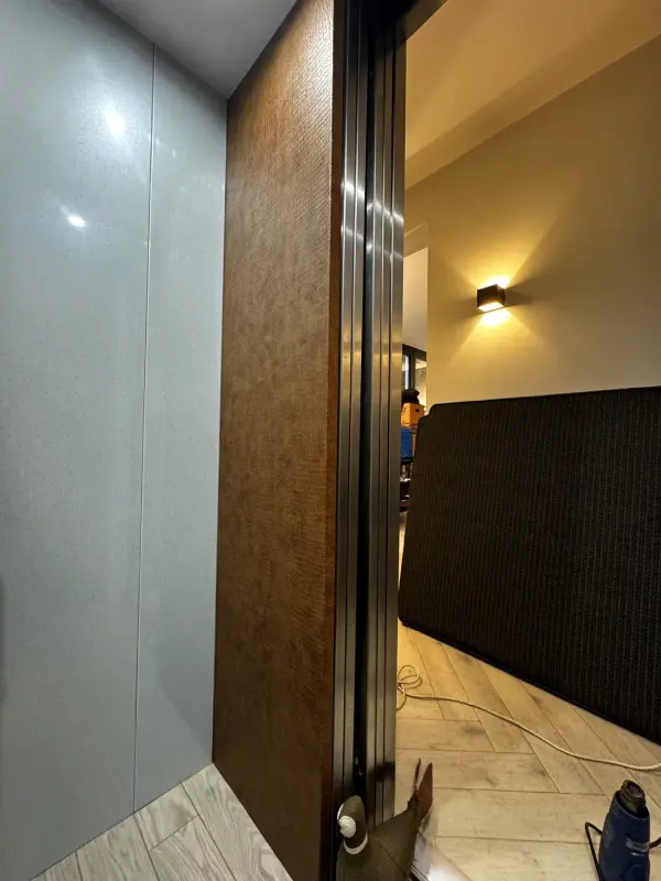 Brown leather-look wall next to a grey lift wall