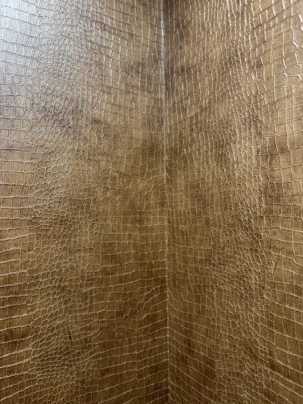 During: brown leather-look wall next to a lift wall that is still grey