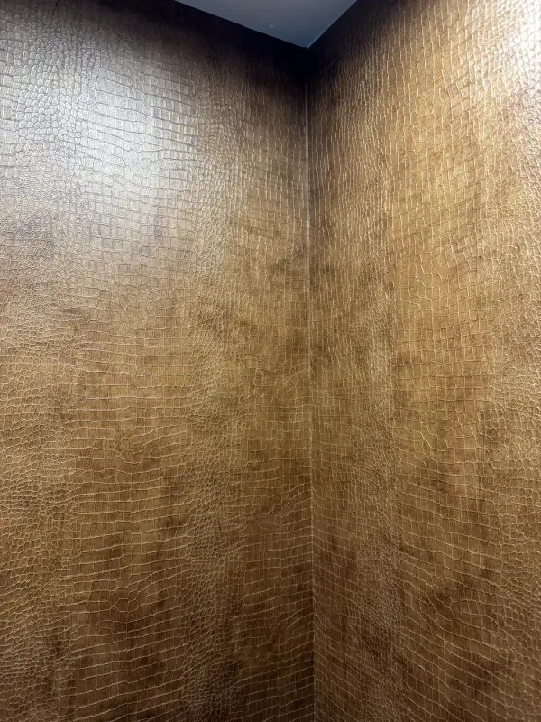 Corner of the lift car in a brown leather look
