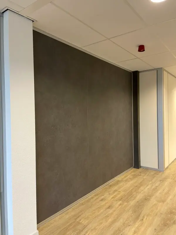 Wood-look wall behind plants, with strip lighting above