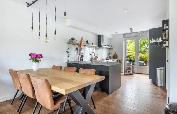 Dining table with the kitchen in the background
